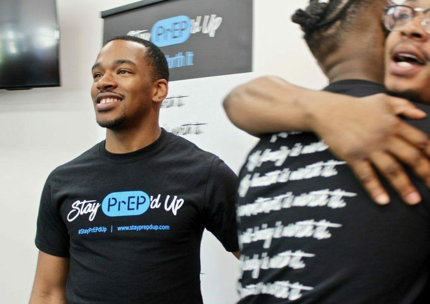 In this 2019 photo, Kenneth Wade, left, is one of the brand ambassadors for a new awareness campaign launched by the AIDS Resource Center of Wisconsin encouraging LGBTQ men and trans women of color to consider taking the HIV prevention pill, PrEP. (Allison Dikanovic/Milwaukee Neighborhood News Service via AP)