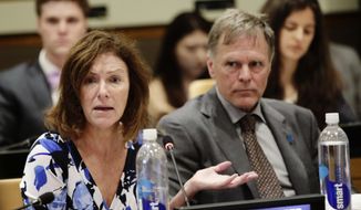 In this May 3, 2018 file photo, Fred Warmbier, right, listens as his wife Cindy Warmbier, speaks of their son Otto Warmbier, an American who died in 2017 days after his release from captivity in North Korea, during a meeting at the United Nations headquarters. (AP Photo/Frank Franklin II)