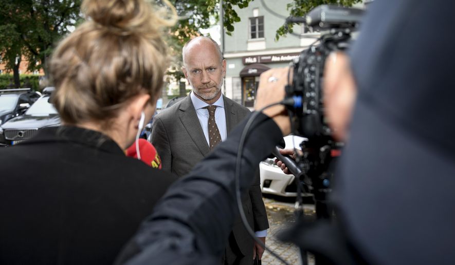 Lawyer Henrik Olsson Lilja faces the media following the court decision against American hip hop star Asap Rocky, the stage name of Rakim Mayers, at the Stockholm District Court in Sweden, Friday July 5, 2019. U.S. rapper A$AP Rocky was ordered held by a Swedish court Friday for two weeks in pre-trial detention while police investigate a fight on Sunday in central Stockholm. (Stina Stjernkvist / TT via AP)