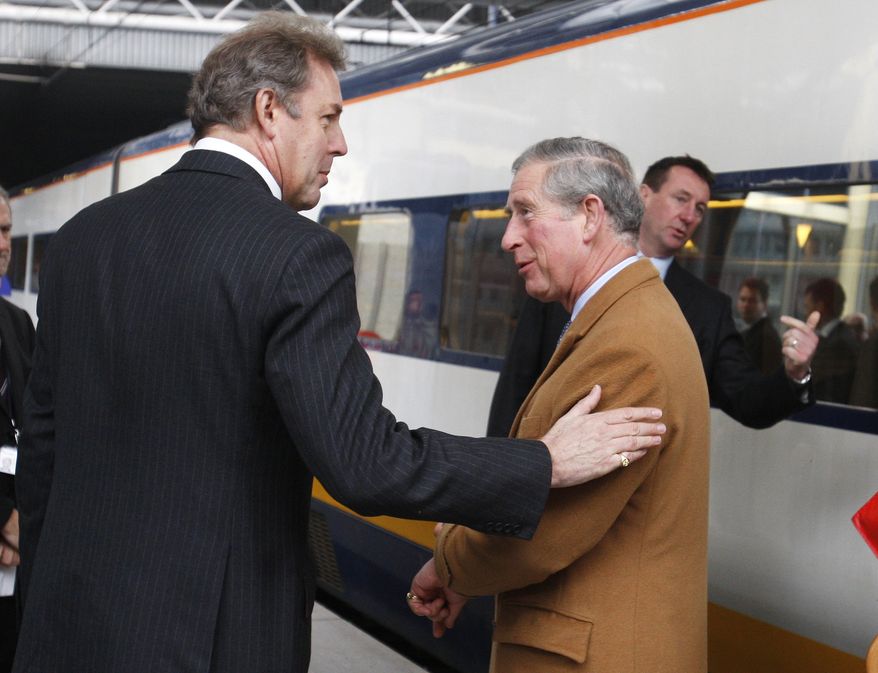 Britain&#39;s Ambassador to the EU Kim Darroch, left, welcomes Britain&#39;s Prince Charles upon his arrival at Brussels Midi train station in Brussels, Wednesday, Feb. 13, 2008. Prince Charles is on a two-day visit to European Union institutions. (AP Photo/Thierry Roge, Pool)