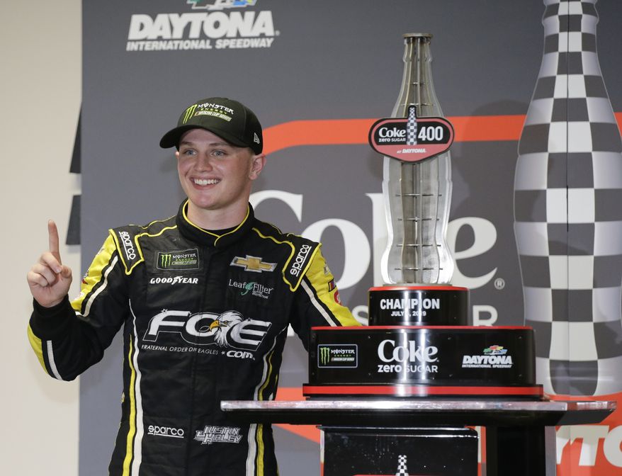 Justin Haley poses for photos with his trophy after winning a NASCAR Cup Series auto race at Daytona International Speedway, Sunday, July 7, 2019, in Daytona Beach, Fla. (AP Photo/Terry Renna)

