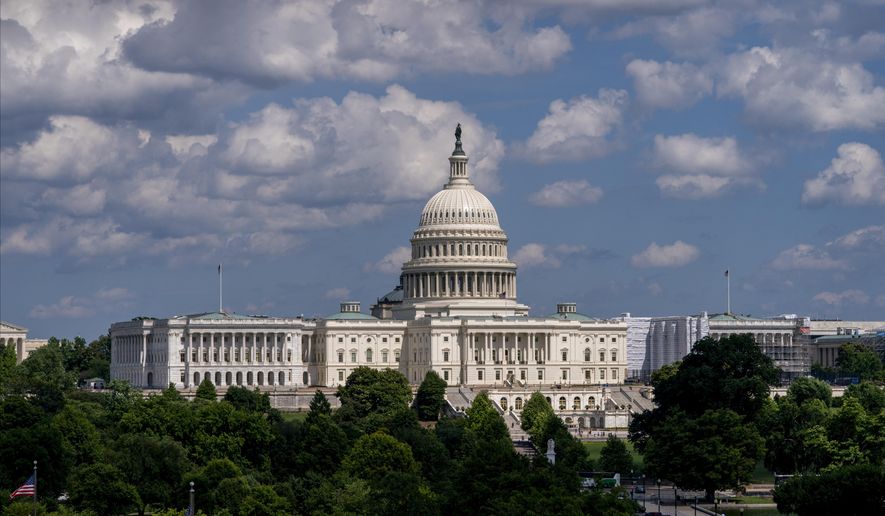 In this June 20, 2019 photo, the Capitol is seen from the roof of the Canadian Embassy in Washington. Health care is on the agenda for Congress when lawmakers return, and it’s not another battle over the Obama-era Affordable Care Act. Instead of dealing with the uninsured, lawmakers are trying to bring down costs for people who already have coverage.  (AP Photo/J. Scott Applewhite)