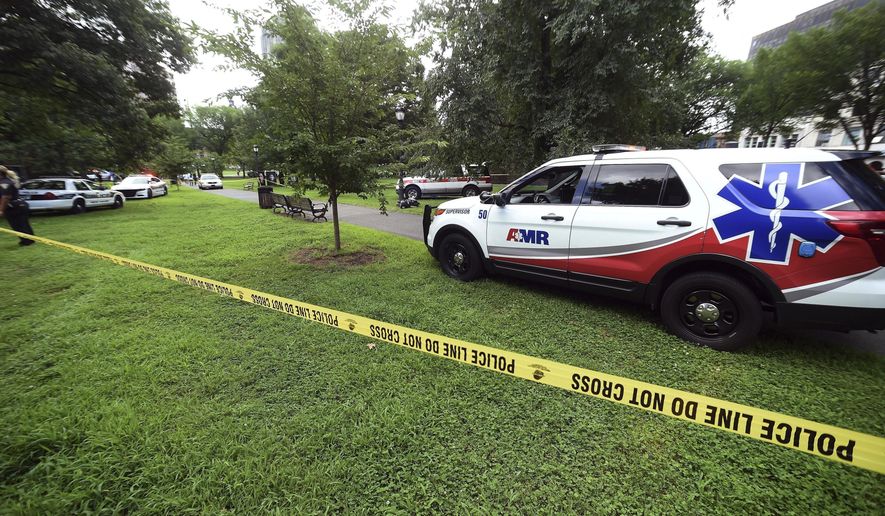 FILE - In this Aug. 15, 2018, file photo, New Haven emergency personnel respond to overdose cases on the New Haven Green in New Haven, Conn. Ambulance personnel across Connecticut want to become political force at the state Capitol by forming a new association. They’re upset that a new law providing post-traumatic stress disorder benefits to certain first responders does not include thousands of paramedics and emergency medical technicians. (Arnold Gold/New Haven Register via AP, File)