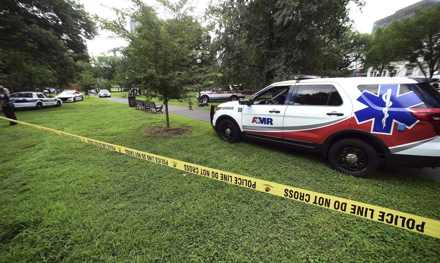 FILE - In this Aug. 15, 2018, file photo, New Haven emergency personnel respond to overdose cases on the New Haven Green in New Haven, Conn. Ambulance personnel across Connecticut want to become political force at the state Capitol by forming a new association. They’re upset that a new law providing post-traumatic stress disorder benefits to certain first responders does not include thousands of paramedics and emergency medical technicians. (Arnold Gold/New Haven Register via AP, File)