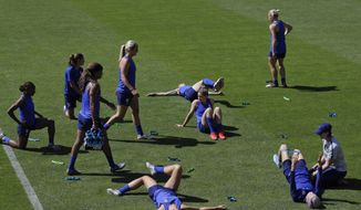United States&#x27; players warm up during a training session at the Gymnase Parc des Sports in Limonest, outside Lyon, France, a day before their Women&#x27;s World Cup final match against the Netherlands, Saturday, July 6, 2019. (AP Photo/Alessandra Tarantino)