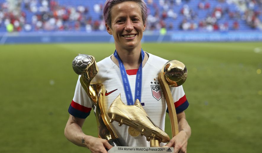 United States' Megan Rapinoe poses with her individual awards at the end of the Women's World Cup final soccer match between US and The Netherlands at the Stade de Lyon in Decines, outside Lyon, France, Sunday, July 7, 2019. The US defeated the Netherlands 2-0. (AP Photo/Francisco Seco)