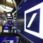 The logo for Deutsche Bank appears above a trading post on the floor of the New York Stock Exchange, Monday, July 8, 2019. (AP Photo/Richard Drew) ** FILE **