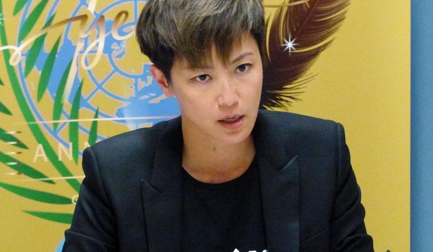 Hong Kong pop singer Denise Ho speaks at the UN building in Geneva, Switzerland, Monday, July 8, 2019. Denise Ho has taken a message of defiance against China to the U.N.'s top human rights body, denouncing "deceitful promises" by authorities and prompting a Chinese diplomat to interrupt her twice. The "Cantopop" star asked the Human Rights Council on Monday whether it would suspend China as one of its 47 member states because of "abuses" by Beijing, and whether the rights body would convene an urgent session to protect people in Hong Kong amid rising protests. (AP Photo/Jamey Keaton)