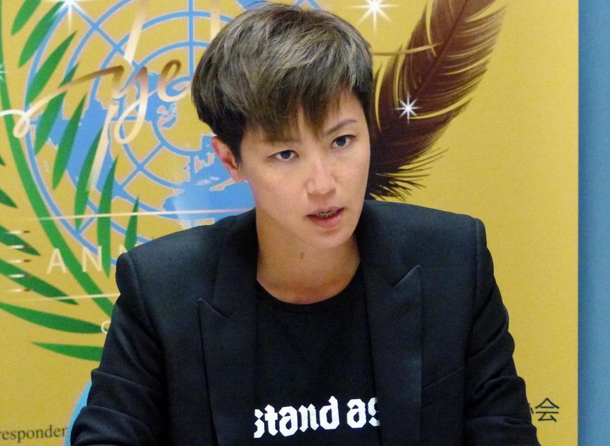 Hong Kong pop singer Denise Ho speaks at the UN building in Geneva, Switzerland, Monday, July 8, 2019. Denise Ho has taken a message of defiance against China to the U.N.'s top human rights body, denouncing "deceitful promises" by authorities and prompting a Chinese diplomat to interrupt her twice. The "Cantopop" star asked the Human Rights Council on Monday whether it would suspend China as one of its 47 member states because of "abuses" by Beijing, and whether the rights body would convene an urgent session to protect people in Hong Kong amid rising protests. (AP Photo/Jamey Keaton)