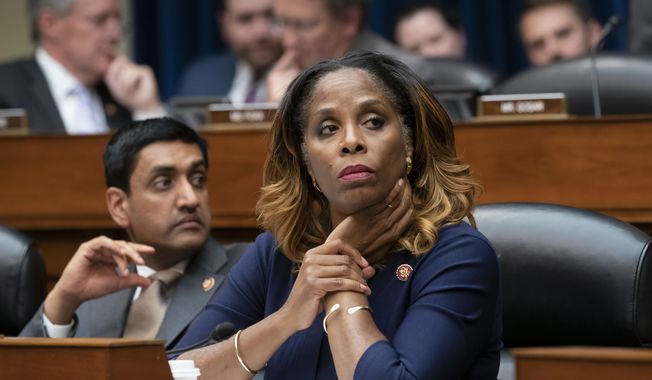 Del. Stacey Plaskett, D-Virgin Islands, joined at left by Rep. Ro Khanna, D-Calif., listen during the roll call as the House Oversight and Reform Committee votes 24-15 to hold Attorney General William Barr and Commerce Secretary Wilbur Ross in contempt for failing to turn over subpoenaed documents related to the Trump administration&#x27;s decision to add a citizenship question to the 2020 census, on Capitol Hill in Washington, Wednesday, June 12, 2019. (AP Photo/J. Scott Applewhite) **FILE**