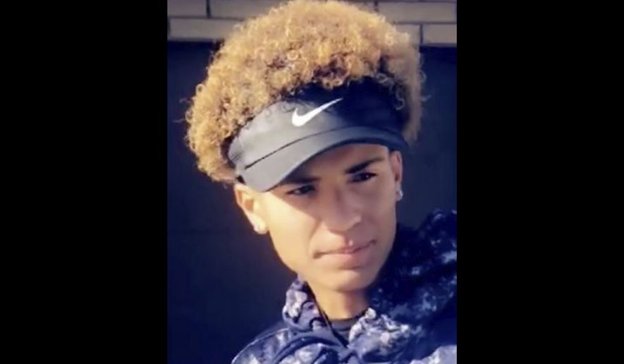 This undated photo provided by Serina Rides shows her son Elijah Al-Amin. Hundreds of people including Democratic presidential candidate Cory Booker spoke out on Twitter this week after Al-Amin, a 17-year-old black youth, was killed at suburban convenience store, allegedly by Michael Adams, a white man who has said he felt threatened by the boy's rap music, on July 4, 2019, in Peoria, Ariz. Adams was charged Tuesday, July 9, 2019, with first-degree murder. (Serina Rides via AP)