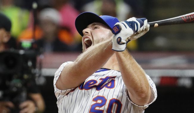 Pete Alonso, of the New York Mets, reacts during the Major League Baseball Home Run Derby, Monday, July 8, 2019, in Cleveland. The MLB baseball All-Star Game will be played Tuesday. (AP Photo/John Minchillo)