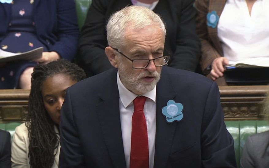 Britain's main opposition Labour Party leader Jeremy Corbyn wears a "Free Nazanin" badge as he speaks during Prime Minister's Questions session at the House of Commons in London, Wednesday June 26, 2019. Nazanin Zaghari-Ratcliffe is a British-Iranian dual citizen who has been imprisoned in Iran for over three years. (House of Commons TV / PA via AP)