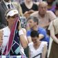 Britain&#39;s Johanna Konta wipes her face during a break of a women&#39;s quarterfinal match against Czech Republic&#39;s Barbora Strycova on day eight of the Wimbledon Tennis Championships in London, Tuesday, July 9, 2019. (AP Photo/Kirsty Wigglesworth)