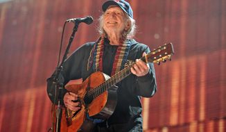 FILE - In this Sept. 19, 2015 file photo, Willie Nelson performs at Farm Aid 30 at FirstMerit Bank Pavilion at Northerly Island in Chicago. Nelson, John Mellencamp, Neil Young and Dave Matthews headline Farm Aid 2019 when the annual music and food festival visits Wisconsin&#x27;s dairy country in September. Tickets for the Sept. 21 event at the Alpine Valley Music Theatre in East Troy, Wisconsin, go on sale Friday, July 12, 2019. (Photo by Rob Grabowski/Invision/AP, File)