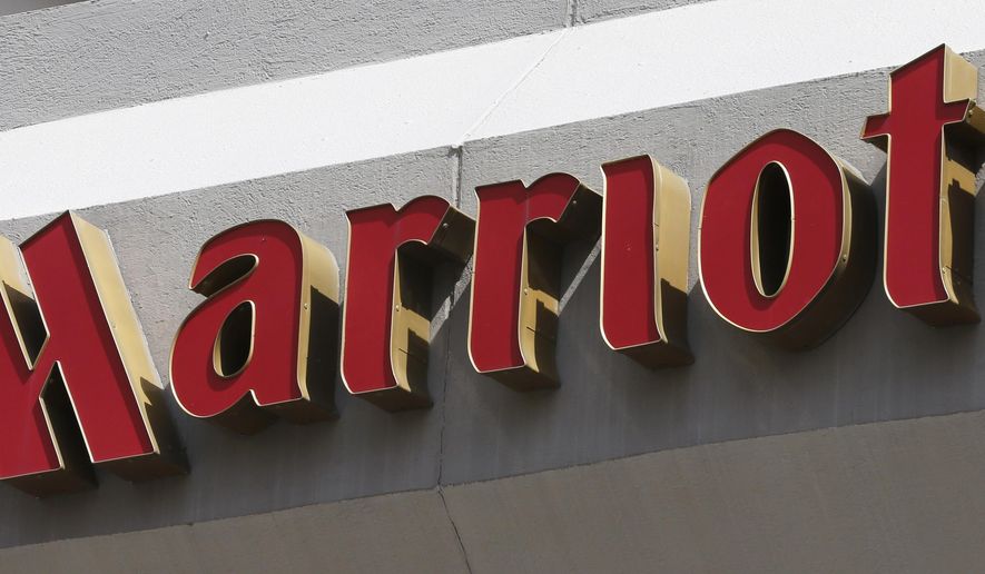 FILE - This Wednesday, March 23, 2016, file photo, shows a sign at a Marriott Hotel in Richmond, Va. Marriott says it will fight a $123 million U.K. government fine related to its massive data breach. (AP Photo/Steve Helber, File)