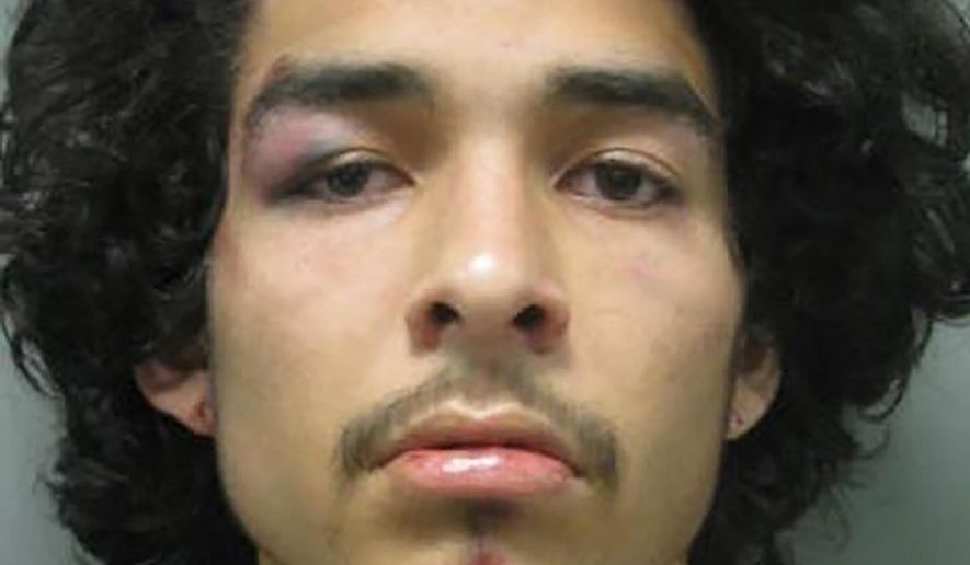 FILE - This Wednesday, July 3, 2019 photo from the Montgomery County Police Department shows Arnaldo Pesoa. Maryland prosecutors have filed an assault charge against a Montgomery County police officer accused of kneeing a handcuffed man's head into a sidewalk outside a restaurant during a videotaped arrest. Court documents filed Tuesday, July 9, 2019, charge Officer Kevin Joseph Moris with second-degree assault and misconduct in office in the July 3 arrest of Pesoa. (Montgomery County Police Department via AP)