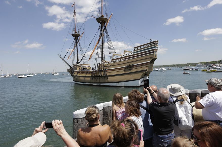 FILE - In this June 6, 2016, file photo, people on a wharf watch as the Mayflower II, the 1957 replica of the famed ship that carried the Pilgrims to Massachusetts in 1620, as it arrives in Plymouth Harbor in Plymouth, Mass. The replica vessel will sail to Boston in 2020 as part of commemoration of the 400th anniversary of the Pilgrims' landing in Massachusetts. Organizers say the Mayflower II will be on display at the Charlestown Navy Yard from May 14 to May 19, 2020. (AP Photo/Steven Senne, File)