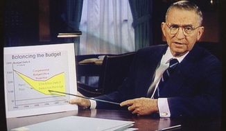 FILE – In this Oct. 16, 1992, file photo, Ross Perot is shown on a screen in a paid 30-minute television commercial, during a media preview in Dallas. Perot, the Texas billionaire who twice ran for president, has died, a family spokesperson said Tuesday, July 9, 2019. He was 89. (AP Photo, File)