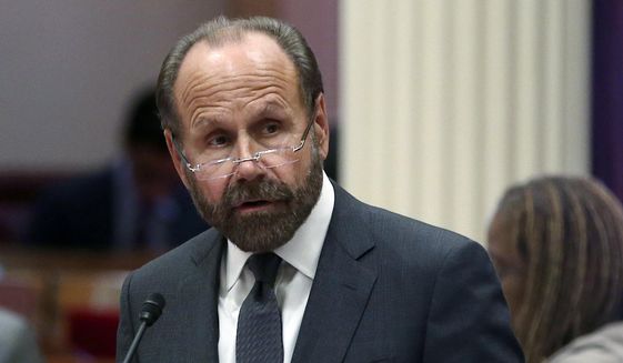 FILE - In this Aug. 27, 2018 file photo state Sen. Jerry Hill, D-San Mateo, speaks on the floor of the Senate, in Sacramento, Calif. Hill has put on hold, Tuesday, July 9,2019 a bill that would have required clergy to report knowledge of child abuse or neglect from their co-workers, even if they learned about it in confession. (AP Photo/Rich Pedroncelli, File)