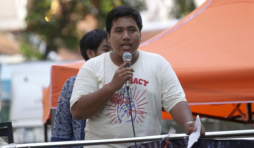 FILE - In this Tuesday, May 22, 2018, file photo, pro-democracy leader Sirawith Seritiwat speaks during a gathering marking the fourth anniversary of the military takeover of the government in Bangkok, Sirawith, who was recently attacked and left unconscious on a Bangkok sidewalk, says he will refuse an offer of police protection that would require him to stop political activities. (AP Photo/Sakchai Lalit, File)