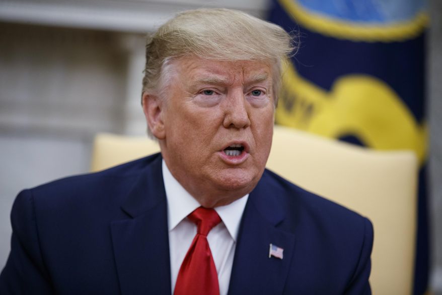 President Donald Trump meets with Qatar's Emir Sheikh Tamim Bin Hamad Al-Thani in the Oval Office of the White House, Tuesday, July 9, 2019, in Washington. (AP Photo/Evan Vucci)