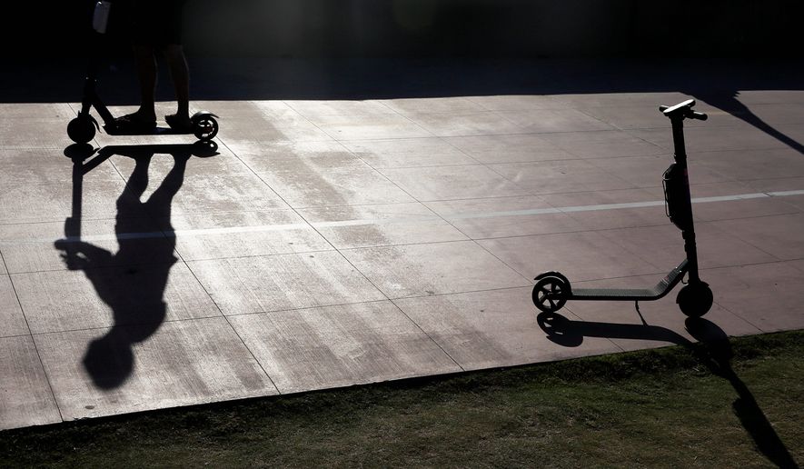 Over the holiday weekend, San Diego's police handed out nearly 100 citations to electric scooter users. Cities are trying to regulate usage of the vehicles. (ASSOCIATED PRESS)