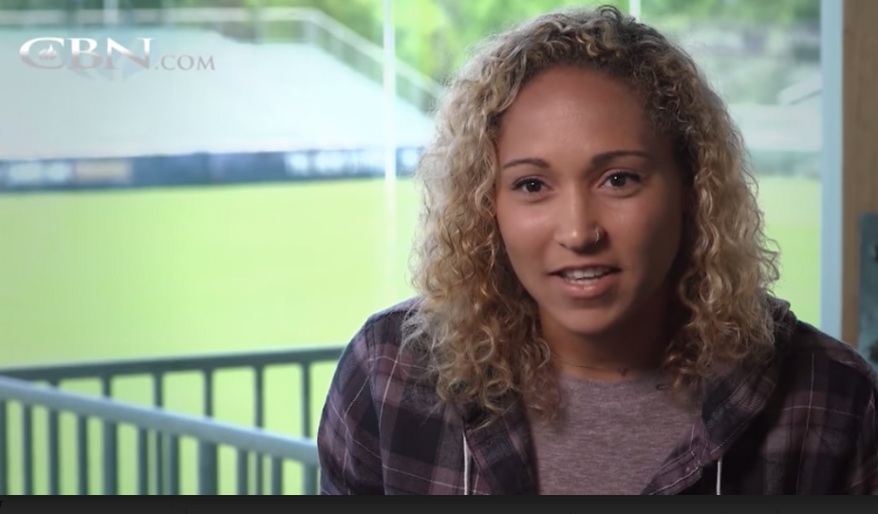 Jaelene Hinkle, a professional women's soccer player shown here in a 2018 CBN interview, famously refused to wear rainbox-colored jerseys in honor of LGBT Pride Month in a 2017 friendly match. Many observers believe Ms. Hinkle's faith-informed decision, considered by detractors to have been homophobic, was a factor in her not making the roster for the 2019 U.S. Women's National Team. (CBN.com screen capture)