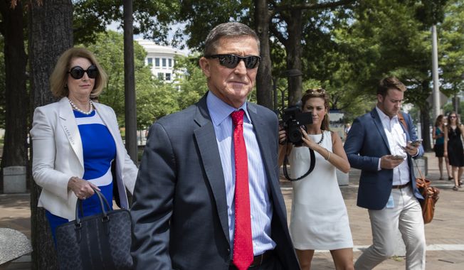 In this June 24, 2019, photo, former National Security Adviser Michael Flynn, leaves the federal courthouse in Washington. with his lawyer Sidney Powell, left. (AP Photo/Manuel Balce Ceneta) ** FILE **
