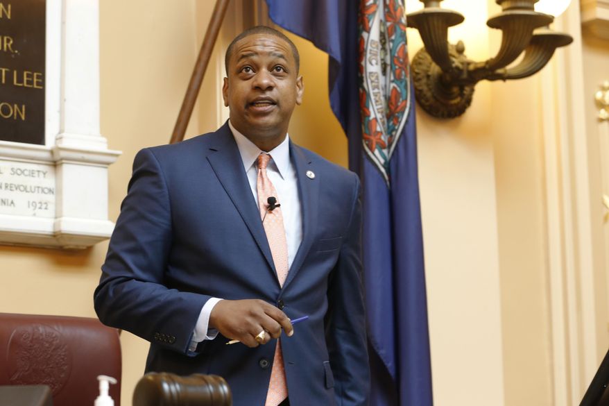 FILE - In this Tuesday July 9, 2019 file photo, Virginia Lt. Gov. Justin Fairfax welcomes visitors at the start of the special session on gun issues at the State Capitol in Richmond, Va. An attorney for Virginia Lt. Gov. Justin Fairfax says there is a witness who can corroborate his story that he did not rape a woman while they were students at Duke University nearly 20 years ago. (AP Photo/Steve Helber, File)