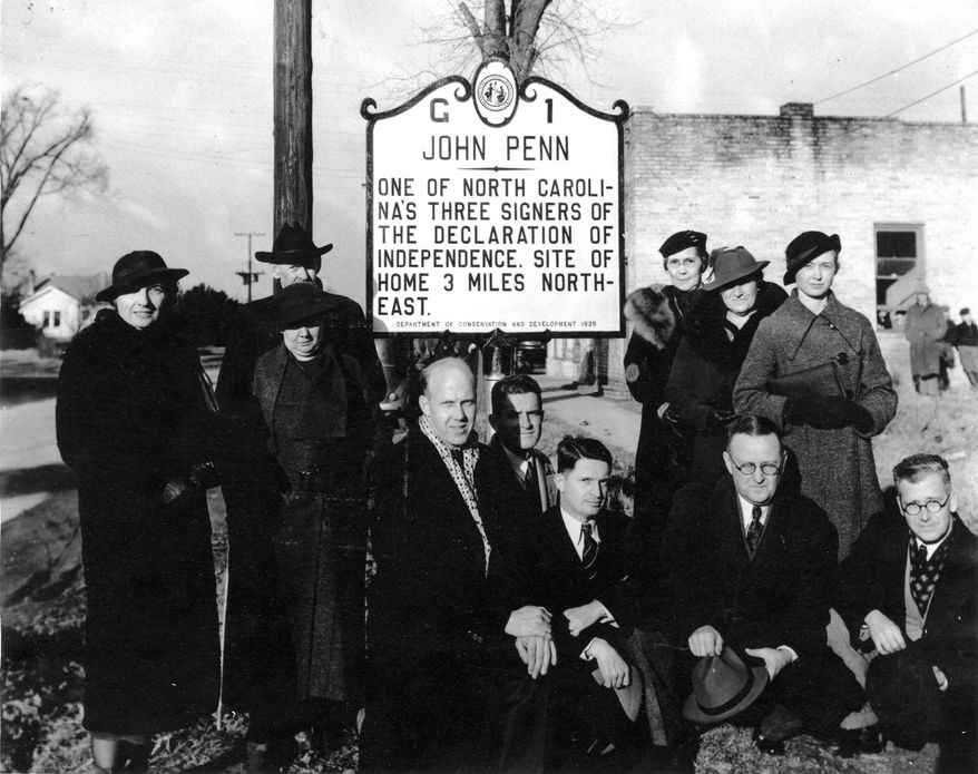 This Jan. 10, 1936 photo provided by the State of North Carolina shows the dedication of North Carolina’s first historical highway marker to John Penn, who signed the U.S. Declaration of Independence. While this marker still stands, six others are missing. Officials say the markers are disappearing faster than the state can afford to replace them. (State of North Carolina via AP)