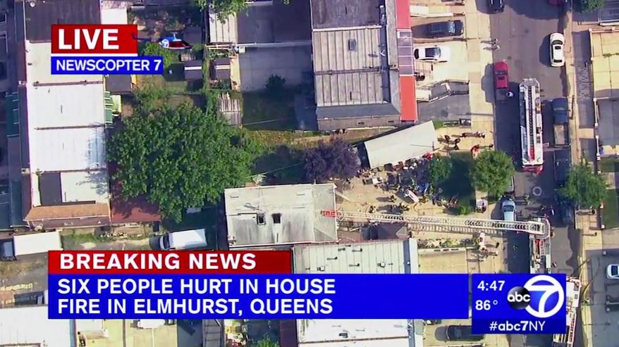 In this image made from video provided by WABC-TV, firefighters battle a two-alarm house fire in the Queens borough of New York, Wednesday, July 10, 2019. Fire officials say the deadly house fire also injured several others. Some of the victims were hospitalized in serious condition. (WABC-TV via AP)