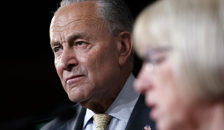 Senate Minority Leader Sen. Chuck Schumer of N.Y., left, listens as Sen. Patty Murray, D-Wash., speaks during a news conference on proposed legislation regarding detention of immigrants, including children, on the southern border, Thursday,  July 11, 2019, on Capitol Hill in Washington. (AP Photo/Jacquelyn Martin)