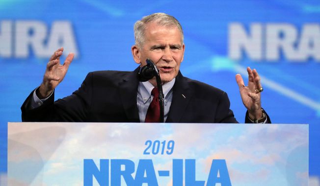 FILE - In this Friday, April 26, 2019, file photo, National Rifle Association President Col. Oliver North speaks at the National Rifle Association Institute for Legislative Action Leadership Forum in Lucas Oil Stadium in Indianapolis. Former NRA President North says in court filings that he was thwarted at every step as he tried to raise alarm bells about alleged misspending at the gun lobbying group. He denied that he had tried to stage a coup to oust NRA’s longtime top executive. (AP Photo/Michael Conroy, File)