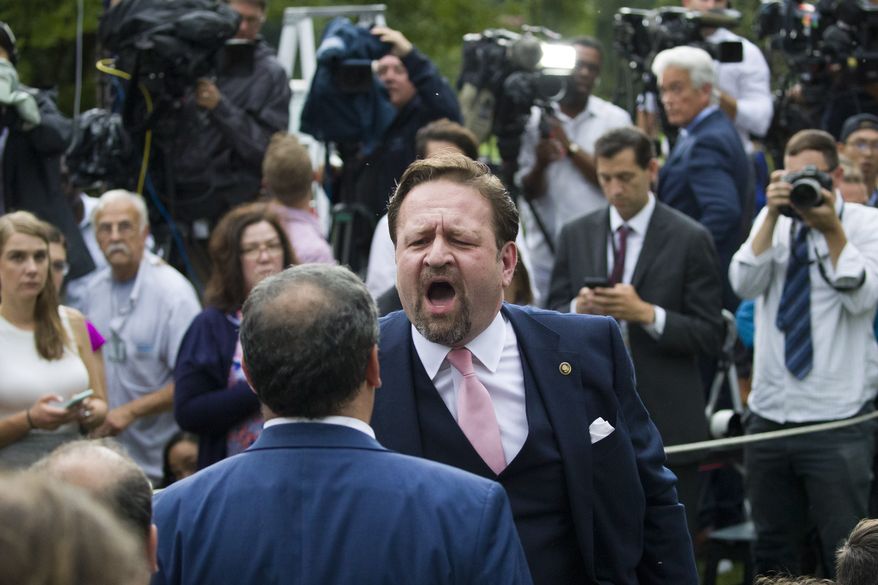 Radio host Sebastian Gorka, yells at Playboy reporter Brian Karem after President Donald Trump spoke about the 2020 census in the Rose Garden of the White House, Thursday, July 11, 2019, in Washington. (AP Photo/Alex Brandon)