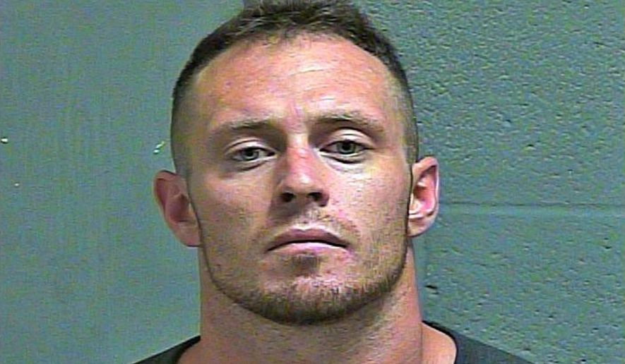 In this photo provided by the Oklahoma County Sheriff's Office, Brandon Killian is pictured in a booking photo dated June 25, 2019. Killian has been charged with a hate crime in the beating of a black man outside of a central Oklahoma music venue last month. (Oklahoma County Sheriff's Office via AP)