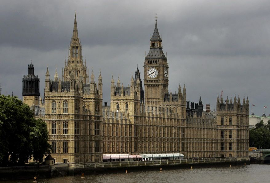 FILE - In this Thursday, July 26, 2007 file photo, a general view of the Houses of Parliament on the river Thames in London. A lawyer’s investigation has found that staff working for British lawmakers face “an unacceptable risk of bullying and harassment,” and some have suffered sexual and physical assaults. Lawyer Gemma White says on Thursday, July 11, 2019 some staff working for lawmakers reported misconduct including “unwelcome sexual advances” and “very serious sexual assault," while others said they’d had had heavy pieces of office equipment thrown at them by employers.(AP Photo/Kirsty Wigglesworth, File)