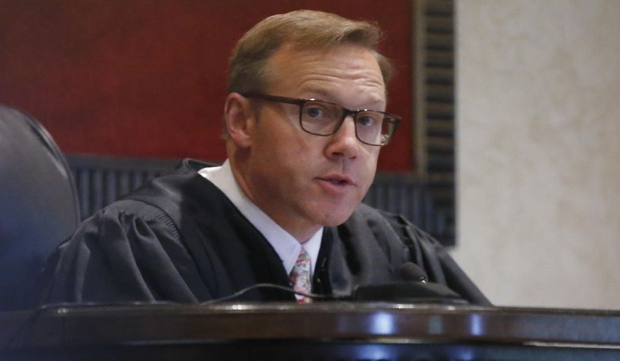 FILE - In this Monday, July 8, 2019 file photo, Judge Thad Balkman speaks during Oklahoma's case blaming consumer products giant Johnson & Johnson and its subsidiaries for the state's opioid drug crisis, in Norman, Okla. Closing arguments are expected to begin on Monday, July 15, 2019. (AP Photo/Sue Ogrocki, File)