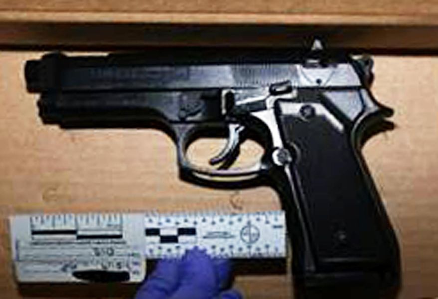 This undated photo provided by the Orange County District Attorney's Office shows what authorities describe as genuine Beretta 92 FS handgun. Authorities say they recovered a replica gun that looks like the Beretta from the scene of the fatal shooting of a 17-year-old girl on a freeway on July 5, 2019. Fullerton, Calif., police said Thursday, July 11, 2019 they'll shortly release body. (Orange County District Attorney's Office via AP)