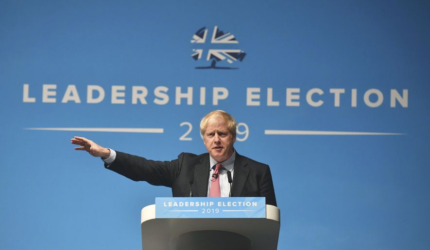 Conservative Party leadership candidate Boris Johnson, gestures, during a Conservative Party leadership hustings in Cheltenham, England, Friday July 12, 2019. (Jacob King/PA via AP)