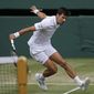 Serbia&#39;s Novak Djokovic returns to Spain&#39;s Roberto Bautista Agut in a Men&#39;s singles semifinal match on day eleven of the Wimbledon Tennis Championships in London, Friday, July 12, 2019. (AP Photo/Kirsty Wigglesworth)