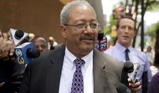 FILE - In this Tuesday, June 21, 2016, file photo, Rep. Chaka Fattah, D-Pa., walks after leaving the federal courthouse in Philadelphia. Fattah, a longtime Pennsylvania congressman serving a 10-year prison term, will ask a judge Friday, July 12, 2019, to reduce his sentence after four bribery and money laundering counts were thrown out on appeal. (AP Photo/Matt Rourke, File)