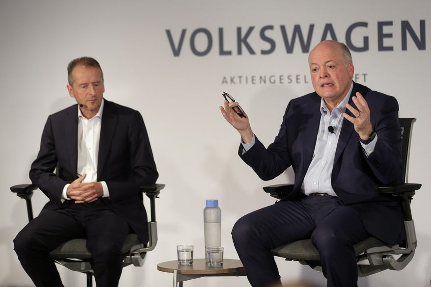 Ford CEO Jim Hackett, right, and Volkswagen CEO Herbert Diess participate in a news conference in New York, Friday, July 12, 2019. Volkswagen will sink $2.6 billion into a Pittsburgh autonomous vehicle company that's mostly owned by Ford as part of a broader partnership on electric and self-driving vehicles, the companies confirmed Friday. (AP Photo/Seth Wenig) ** FILE **