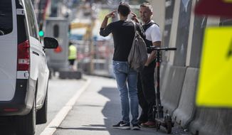 The police talks to a tourist after he drove an electric scooter in the Opera tunnel in Oslo, Friday, July 12, 2019. Police in Oslo say they have stopped a foreign tourist who was caught on surveillance cameras riding through part of a vast and busy tunnel system in the center of the Norwegian capital on an electric scooter.  Police tweeted that the male tourist, who wasn’t identified, had followed a route given by Google Maps to explain why he had entered the nearly 16-kilometer (10-mile) long Opera Tunnel complex. (Trond Reidar Teigan/NTB Scanpix via AP)