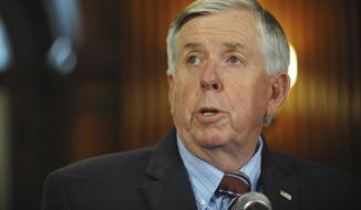 FILE - In this May 29, 2019 file photo, Gov. Mike Parson addresses the media during a news conference in his Capitol office in Jefferson City, MO. Hundreds of Missouri prisoners serving mandatory sentences for largely nonviolent offenses could become eligible for parole under a new law enacted Tuesday, July 9, that Gov. Parson touted as a criminal justice reform. (Julie Smith/The Jefferson City News-Tribune via AP File)