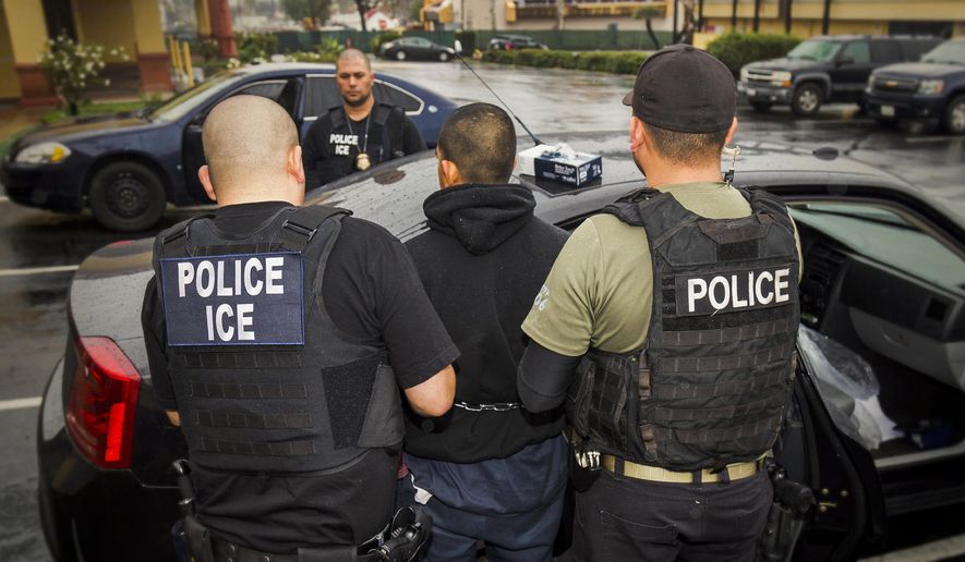 In this Tuesday, Feb. 7, 2017, file photo released by U.S. Immigration and Customs Enforcement, foreign nationals are arrested during a targeted enforcement operation conducted by U.S. Immigration and Customs Enforcement (ICE) aimed at immigration fugitives, re-entrants and at-large criminal aliens in Los Angeles. (Charles Reed/U.S. Immigration and Customs Enforcement via AP) ** FILE **