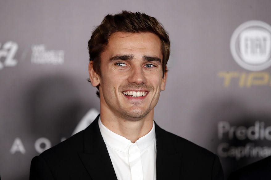 FILE - In this Monday, Dec.3, 2018 file photo, Atletico Madrid's Antoine Griezmann arrives for the Golden Ball, "Ballon d'Or" award ceremony at the Grand Palais in Paris, France. Barcelona says France forward Antoine Griezmann has agreed to join the Spanish champions after it paid his buyout clause to free him from rival Atletico Madrid. Barcelona says on Friday, July 12, 2019 that Griezmann will strengthen an attack led by Lionel Messi and Luis Suarez after signing a five-year contract. (AP Photo/Christophe Ena, file)