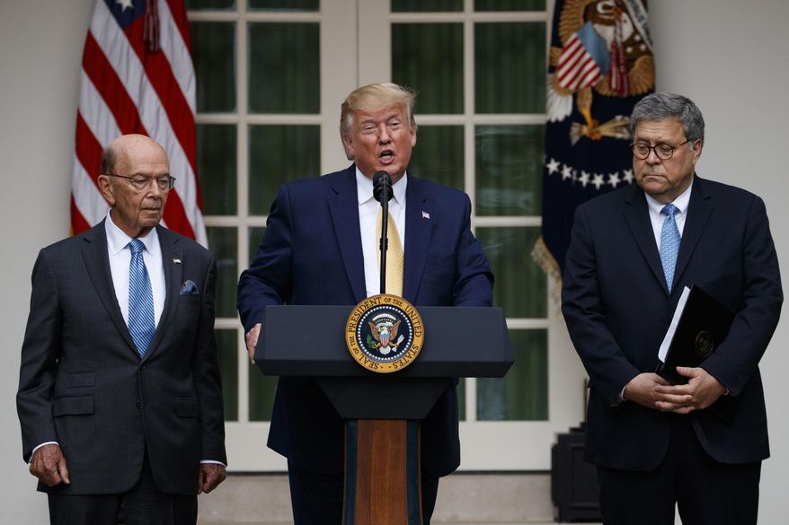 President Donald Trump, joined by Commerce Secretary Wilbur Ross, left, and Attorney General William Barr, speaks during an event about the census in the Rose Garden at the White House in Washington, Thursday, July 11, 2019. (AP Photo/Carolyn Kaster)