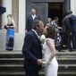 Associated Press staff photographer Gerald Herbert and Lucy Sikes kiss after being wed at Mater Dolorosa Catholic Church ahead of Tropical Storm Barry in New Orleans, Friday, July 12, 2019. Originally scheduled for Saturday, the couple moved the nuptials up a day to avoid the arrival of Barry. (Max Becherer/The Advocate via AP)
