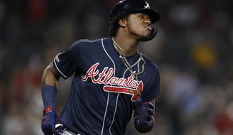 Atlanta Braves&#39; Ronald Acuna Jr. reacts after hitting a home run during the fifth inning of the team&#39;s baseball game against the San Diego Padres, Friday, July 12, 2019, in San Diego. (AP Photo/Gregory Bull)